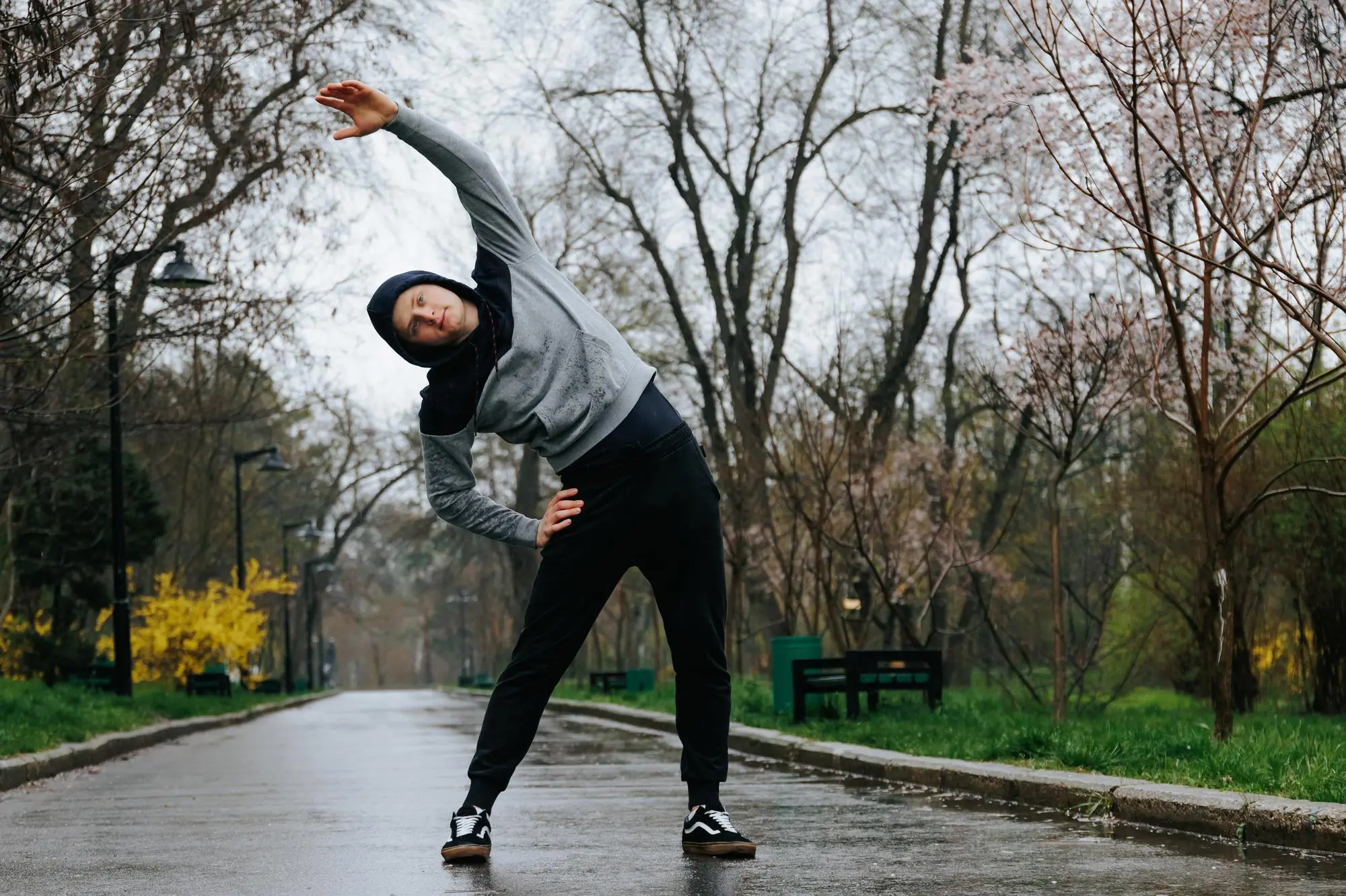 woman stretching in the park in the winter